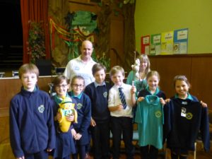 Andy of Koolskools with Monica Malet, the Fairtrade teacher at St Joseph’s Catholic Primary School in Aberdeen, plus members of the school’s Fairtrade Committee, after a Koolskools Fairtrade Assembly. St Joseph’s have made the switch to Koolskools Fairtrade cotton uniform!