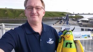 Peter Hutchinson of North Link Ferries, a distinguished Fairtrade campaigner, wearing his new Koolskools corporate polo made with Fairtrade cotton. 