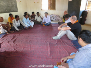 Farmers involved in decision-making on the Fairtrade Premium in Kharsenbanji Odisha, India, talk to Mike and Andy of Koolskools and their India agent, Ranga.
